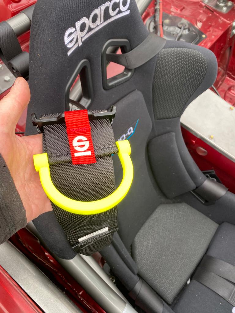 Racecar seatbelt/harness handle